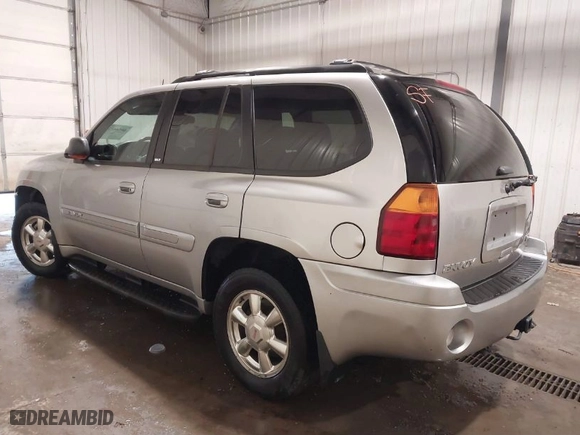 2004 GMC Envoy SLE with VIN 1GKDT13S042139622, listed as a IAAI auction lot 40546237 with 168,715 mi miles. Bid and sale history available at carsss.com. Image 3.