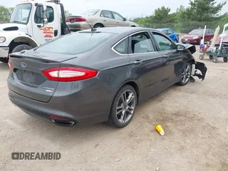 2016 Ford Fusion Titanium with VIN 3FA6P0D97GR133823, listed as a IAAI auction lot 42429708 with 166,105 mi miles and . Bid and sale history available at DreamBid. Image 4.