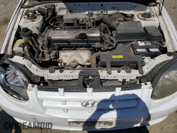 2003 Hyundai Accent с VIN KMHCF35C53U240220, выставлен на аукционе Copart как лот 52581415 с пробегом 102 322 миль миль и Списание • Salvage title. История ставок и продаж доступна на DreamBid. Изображение 11.