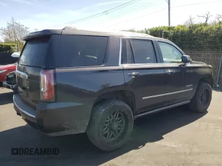 2015 GMC Yukon Denali with VIN 1GKS2CKJ8FR596848, listed as a Copart auction lot 52048105 with 129,935 mi miles and Salvage Title. Bid and sale history available at carsss.com. Image 3.