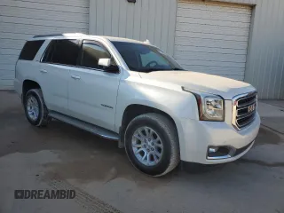 2015 GMC Yukon SLT with VIN 1GKS1BKCXFR563509, listed as a Copart auction lot 77188854 with 127,481 mi miles and Clean Title. Bid and sale history available at carsss.com. Image 4.