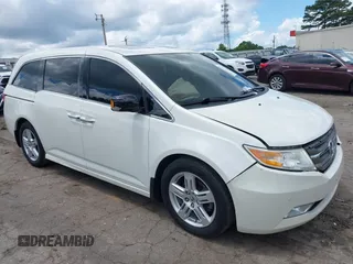 2013 Honda Odyssey Touring with VIN 5FNRL5H96DB054506, listed as a IAAI auction lot 42530103 with 164,978 mi miles and . Bid and sale history available at DreamBid. Image 1.