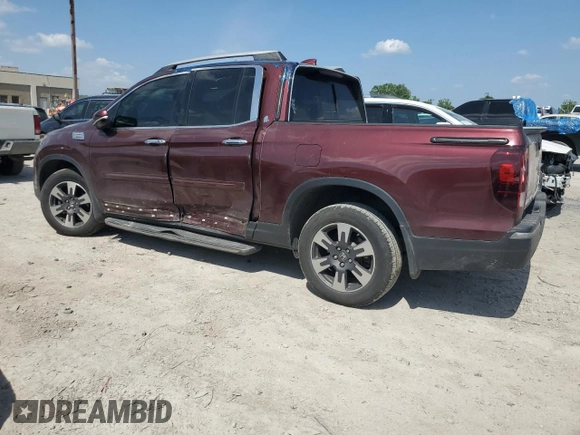 2019 Honda Ridgeline RTL-E with VIN 5FPYK3F71KB002046, listed as a Copart auction lot 61934455 with 131,674 mi miles and Salvage title. Bid and sale history available at DreamBid. Image 2.
