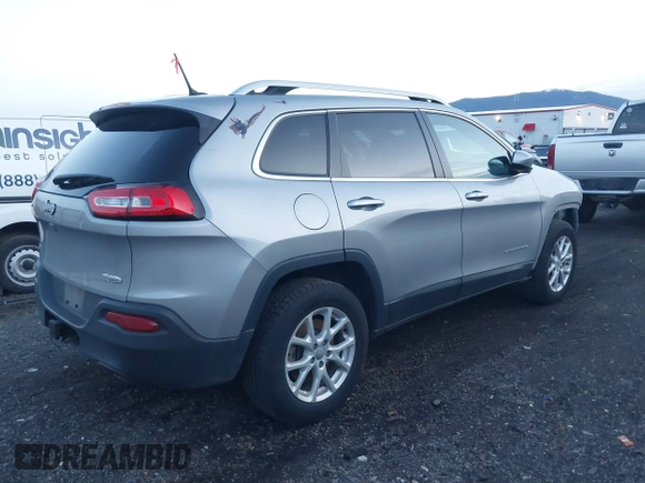 2014 Jeep Cherokee Latitude with VIN 1C4PJMCSXEW220556, listed as a IAAI auction lot 41060501 with 70,152 mi miles and . Bid and sale history available at carsss.com. Image 4.