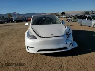 2020 Tesla Model Y Long Range with VIN 5YJYGDEE4LF015455, listed as a Copart auction lot 84223984 with 77,398 mi miles and Salvage Title. Bid and sale history available at DreamBid. Image 11.