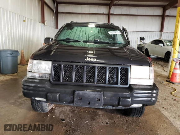 1998 Jeep Grand Cherokee Limited z VIN 1J4GZ88Z0WC276394, wystawiony jako Copart lot #46702355 z przebiegiem 144 232 mil mil oraz Szkoda całkowita • Salvage title. Historia ofert i sprzedaży dostępna na DreamBid. Obrazek 5.
