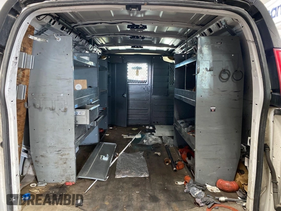 2015 Chevrolet Express Cargo Van with VIN 1GCWGFCF6F1215880, listed as a IAAI auction lot 42175576 with 189,599 mi miles. Bid and sale history available at carsss.com. Image 1.