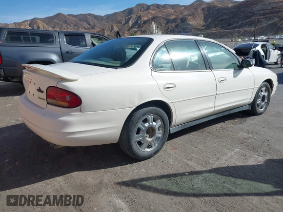 2001 Oldsmobile Intrigue GX z VIN 1G3WH52H11F140740, wystawiony jako IAAI lot #40799284 z przebiegiem 131 940 mil mil oraz . Historia ofert i sprzedaży dostępna na DreamBid. Obrazek 4.