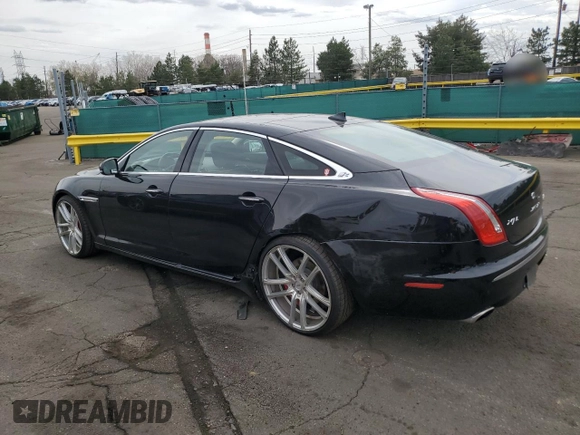 2014 Jaguar XJ Portfolio with VIN SAJWJ2GD4E8V69651, listed as a Copart auction lot 52426195 with 56,413 mi miles and Salvage title. Bid and sale history available at DreamBid. Image 2.
