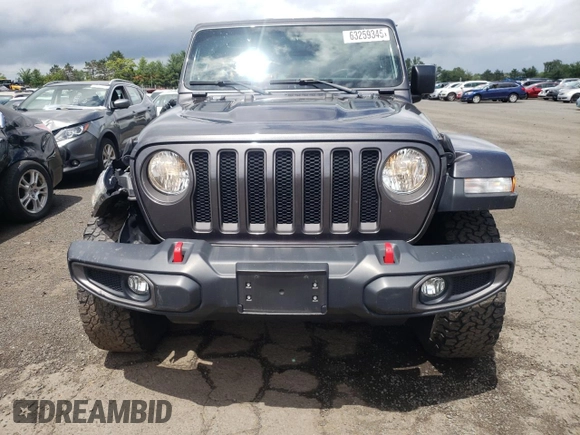 2018 Jeep Wrangler Unlimited Rubicon with VIN 1C4HJXFG1JW261472, listed as a Copart auction lot 63259345 with 60,457 mi miles and Salvage title. Bid and sale history available at DreamBid. Image 5.