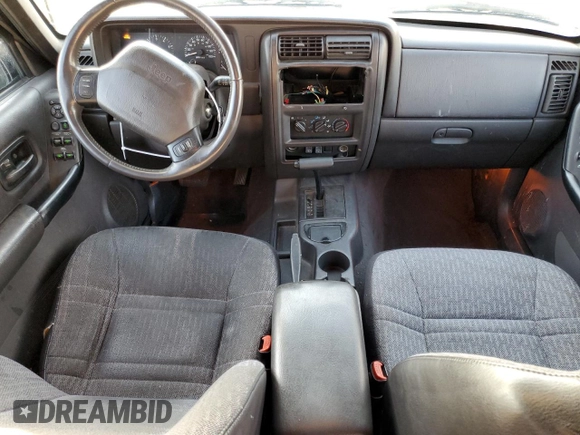 2001 Jeep Cherokee Sport with VIN 1J4FT48S51L568981, listed as a Copart auction lot 82471104 with 181,870 mi miles and Salvage Title. Bid and sale history available at carsss.com. Image 8.