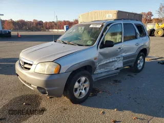 2002 Mazda Tribute LX with VIN 4F2YU08102KM60299, listed as a Copart auction lot 78590014 with 225,489 mi miles and Salvage Title. Bid and sale history available at DreamBid. Image 1.