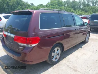 2010 Honda Odyssey Touring z VIN 5FNRL3H92AB010292, wystawiony jako IAAI lot #42469216 z przebiegiem 188 921 mil mil oraz . Historia ofert i sprzedaży dostępna na DreamBid. Obrazek 4.