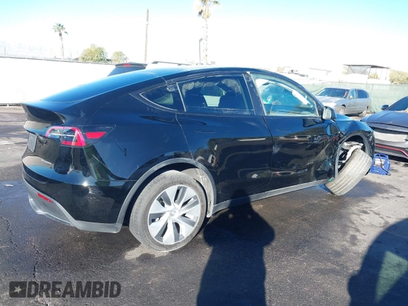 2023 Tesla Model Y Long Range with VIN 7SAYGDEE8PA151965, listed as a IAAI auction lot 41343497 with 25,869 mi miles. Bid and sale history available at carsss.com. Image 4.