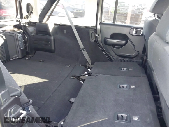 2018 Jeep Wrangler Unlimited Sport S with VIN 1C4HJXDN0JW255003, listed as a IAAI auction lot 41528394 with 55,660 mi miles and . Bid and sale history available at DreamBid. Image 8.