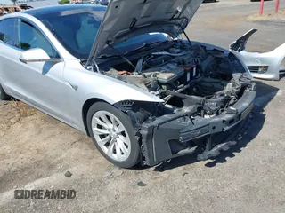 2016 Tesla Model S 90D with VIN 5YJSA1E22GF174637, listed as a IAAI auction lot 42234083 with 142,915 mi miles and . Bid and sale history available at DreamBid. Image 6.