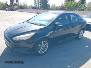 2015 Ford Focus SE with VIN 1FADP3F23FL313614, listed as a IAAI auction lot 42153320 with 121,346 mi miles. Bid and sale history available at carsss.com. Image 2.