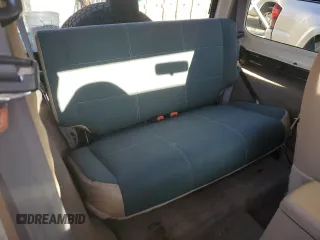 2000 Jeep Wrangler Sahara with VIN 1J4FA59S0YP795198, listed as a Copart auction lot 87920205 with 150,148 mi miles and Salvage Title. Bid and sale history available at carsss.com. Image 10.