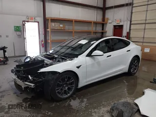 2022 Tesla Model S with VIN 5YJSA1E59NF469984, listed as a IAAI auction lot 42426490 with Not provided miles and . Bid and sale history available at DreamBid. Image 2.