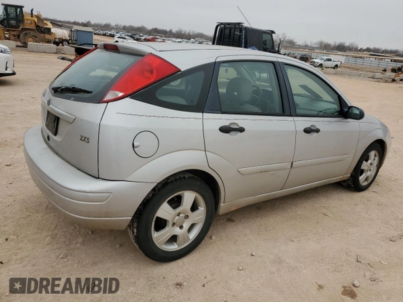 2004 Ford Focus with VIN 3FAFP37Z14R102723, listed as a Copart auction lot 44138195 with 220,354 mi miles and Salvage title. Bid and sale history available at DreamBid. Image 3.