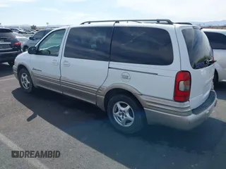 2002 Pontiac Montana with VIN 1GMDX03EX2D120237, listed as a IAAI auction lot 41858448 with 128,022 mi miles and . Bid and sale history available at DreamBid. Image 3.
