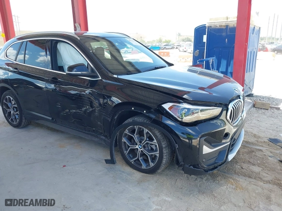 2021 BMW X1 sDrive28i with VIN WBXJG7C02M5S59010, listed as a IAAI auction lot 41933532 with 49,207 mi miles. Bid and sale history available at carsss.com. Image 6.