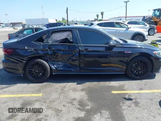 2019 Volkswagen Jetta GLI S z VIN 3VW6T7BU4KM255418, wystawiony jako IAAI lot #42141020 z przebiegiem 74 066 mil mil oraz . Historia ofert i sprzedaży dostępna na DreamBid. Obrazek 13.
