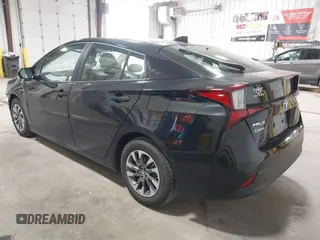 2022 Toyota Prius L Eco with VIN JTDKAMFU2N3186072, listed as a IAAI auction lot 42486252 with 5,887 mi miles and . Bid and sale history available at DreamBid. Image 3.