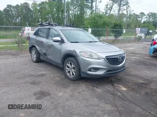 2015 Mazda CX-9 Touring z VIN JM3TB2CA1F0455916, wystawiony jako IAAI lot #42226924 z przebiegiem 157 643 mil mil oraz . Historia ofert i sprzedaży dostępna na DreamBid. Obrazek 1.