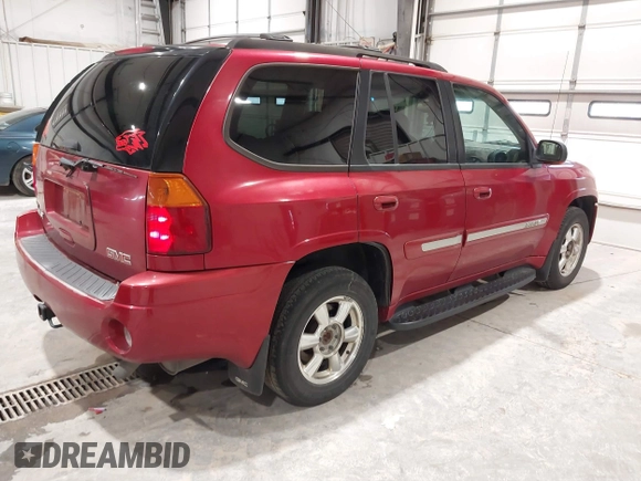 2005 GMC Envoy SLT with VIN 1GKDT13S352324863, listed as a IAAI auction lot 41707649 with 247,326 mi miles. Bid and sale history available at carsss.com. Image 4.