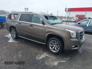 2015 GMC Yukon XL SLE z VIN 1GKS1GKC2FR685715, wystawiony jako IAAI lot #41857954 z przebiegiem 212 091 mil mil oraz . Historia ofert i sprzedaży dostępna na DreamBid. Obrazek 1.