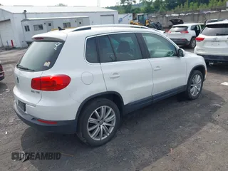 2012 Volkswagen Tiguan SE with VIN WVGAV7AX9CW607960, listed as a IAAI auction lot 42679977 with 106,335 mi miles and . Bid and sale history available at DreamBid. Image 4.