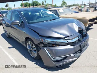 2018 Honda Clarity Touring z VIN JHMZC5F33JC021811, wystawiony jako IAAI lot #42272808 z przebiegiem 82 414 mil mil oraz . Historia ofert i sprzedaży dostępna na DreamBid. Obrazek 1.