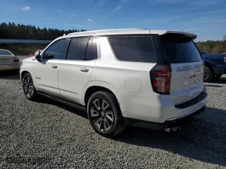 2021 Chevrolet Tahoe High Country with VIN 1GNSKTKLXMR228088, listed as a Copart auction lot 79671804 with 53,997 mi miles and Salvage Title. Bid and sale history available at carsss.com. Image 2.