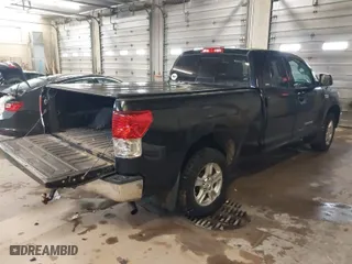 2013 Toyota Tundra 4WD Truck with VIN 5TFUW5F16DX305142, listed as a IAAI auction lot 41139364 with 212,390 mi miles. Bid and sale history available at carsss.com. Image 4.
