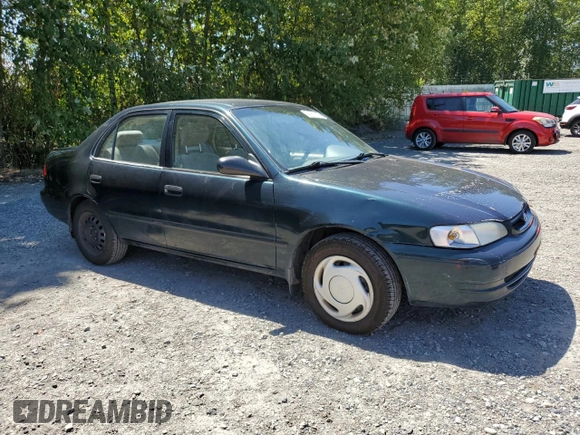 1999 Toyota Corolla VE with VIN 1NXBR12E7XZ240321, listed as a Copart auction lot 64259115 with 144,145 mi miles and Salvage title. Bid and sale history available at DreamBid. Image 4.