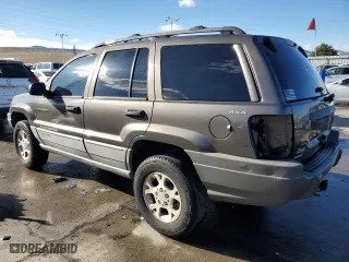 1999 Jeep Grand Cherokee Laredo with VIN 1J4GW58N9XC633464, listed as a Copart auction lot 84682454 with 212,738 mi miles and Salvage Title. Bid and sale history available at carsss.com. Image 2.