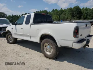2000 Ford F-150 XL z VIN 1FTRX18L0YNA65615, wystawiony jako Copart lot #58508375 z przebiegiem Nie podano mil oraz Szkoda całkowita • Salvage title. Historia ofert i sprzedaży dostępna na DreamBid. Obrazek 2.