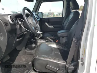 2015 Jeep Wrangler Unlimited Sahara with VIN 1C4BJWEG7FL768712, listed as a Copart auction lot 49963335 with 100,053 mi miles and Salvage Title. Bid and sale history available at carsss.com. Image 7.
