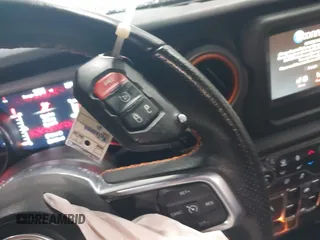2021 Jeep Gladiator Mojave z VIN 1C6JJTEG5ML524829, wystawiony jako IAAI lot #42247982 z przebiegiem 20 158 mil mil oraz . Historia ofert i sprzedaży dostępna na DreamBid. Obrazek 11.