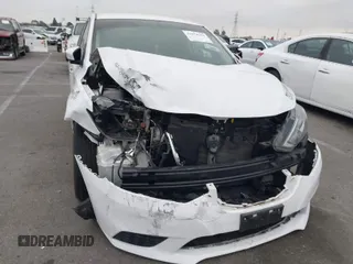 2019 Nissan Sentra S z VIN 3N1AB7AP6KY282353, wystawiony jako IAAI lot #41870690 z przebiegiem 61 450 mil mil oraz . Historia ofert i sprzedaży dostępna na DreamBid. Obrazek 1.