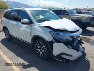2021 Honda Pilot Touring 8-Passenger z VIN 5FNYF6H94MB087593, wystawiony jako IAAI lot #42153310 z przebiegiem 30 400 mil mil oraz . Historia ofert i sprzedaży dostępna na DreamBid. Obrazek 1.