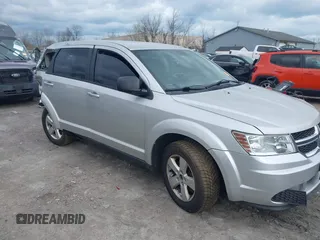 2013 Dodge Journey SE with VIN 3C4PDCAB9DT532554, listed as a IAAI auction lot 42026129 with 164,599 mi miles. Bid and sale history available at carsss.com. Image 1.