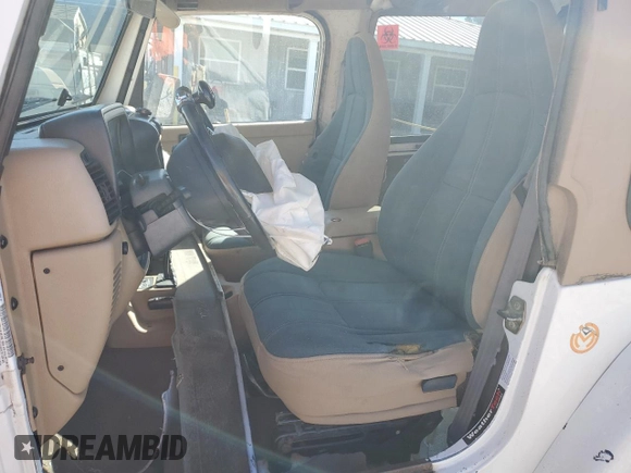 2000 Jeep Wrangler Sahara with VIN 1J4FA59SXYP764539, listed as a Copart auction lot 52707385 with 136,159 mi miles and Salvage title. Bid and sale history available at DreamBid. Image 7.