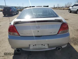 2006 Hyundai Tiburon GT z VIN KMHHN65F76U190851, wystawiony jako Copart lot #45935795 z przebiegiem 102 335 mil mil oraz Szkoda całkowita • Salvage title. Historia ofert i sprzedaży dostępna na DreamBid. Obrazek 6.