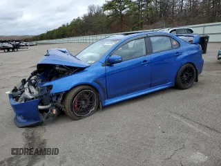2015 Mitsubishi Lancer Evolution GSR z VIN JA32W8FV7FU023106, wystawiony jako Copart lot #40867084 z przebiegiem 103 964 mil mil oraz Szkody całkowita. Historia ofert i sprzedaży dostępna na DreamBid. Obrazek 1.