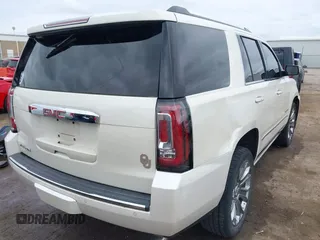 2015 GMC Yukon Denali with VIN 1GKS2CKJ7FR737165, listed as a IAAI auction lot 41914478 with 156,059 mi miles. Bid and sale history available at carsss.com. Image 4.