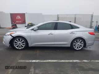 2014 Hyundai Azera Limited with VIN KMHFH4JG7EA388931, listed as a IAAI auction lot 41468407 with 130,597 mi miles and . Bid and sale history available at DreamBid. Image 14.