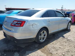 2013 Ford Taurus SEL with VIN 1FAHP2E83DG111766, listed as a IAAI auction lot 42041504 with 158,468 mi miles. Bid and sale history available at carsss.com. Image 4.