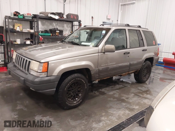 1998 Jeep Grand Cherokee Laredo with VIN 1J4GZ58S3WC343555, listed as a IAAI auction lot 41528943 with 219,146 mi miles. Bid and sale history available at carsss.com. Image 18.